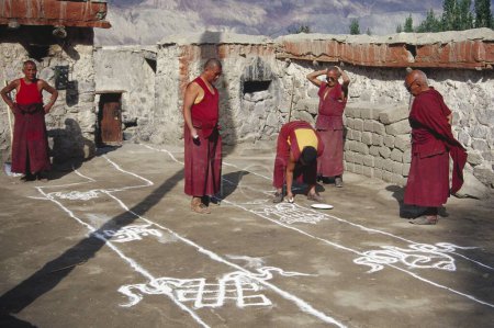 Photo for Buddhist Lamas making Rangoli - Samtanling Gompa - Sumar Village , Nubra Valley , Ladakh , India - Royalty Free Image