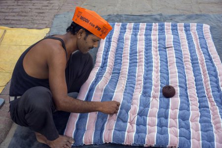 Photo for Mattress Maker Wearing Modi Cap Varanasi uttar pradesh India Asia - Royalty Free Image