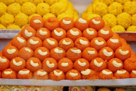 Laddu ; Indian sweet Bundi Besan Motichur Rava besan display for sale near Khajrana Ganesh temple ; Indore ; Madhya Pradesh ; India