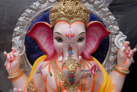 Photo for Close ups of Idol of Lord Ganesh ganpati for sale during Ganesh festival ; Mumbai Bombay ; Maharashtra ; India - Royalty Free Image