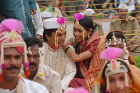 Photo for Couples getting married at mass marriage function organized by Sant Nirankari Mission at Airoli, New Bombay now Navi Mumbai, Maharashtra, India - Royalty Free Image