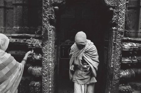 Photo for Priest coming out of Vishwanath Temple , Varanasi , Uttar Pradesh, India - Royalty Free Image