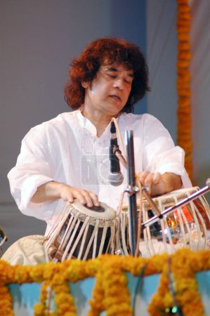 Photo for Music , Indian Classical Music , Musical Instrument , Drum , Tabla , Artist Ustad Zakir Hussain , Rhythm , Performing - Royalty Free Image
