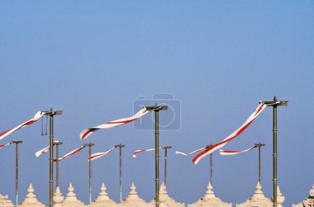 Photo for Red and white flags fluttering above Jain temples in Palitana ; Gujarat ; India - Royalty Free Image