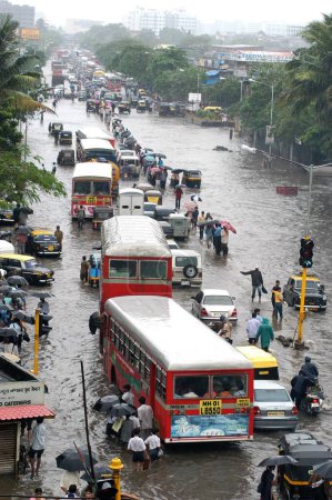 Photo for On the heavy rainfall day some parts of Bombay ; now Mumbai city takes shape of an island ; Similar situation is here on such a heavy rainfall day ; the Lal Bahadur Shastri Marg at Kurla in the central suburb of Bombay Mumbai city ; Maharashtra ; Ind - Royalty Free Image