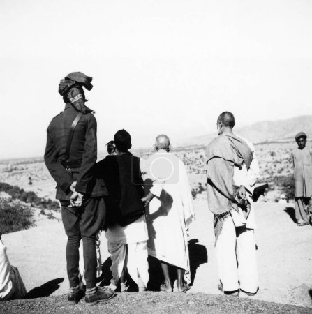 Photo for Khan Abdul Gaffar Khan , Mahatma Gandhi and others viewing the landscape during Mahatma Gandhis visit to the North West Frontier Provinces to Afghanistan , October 1938 - Royalty Free Image