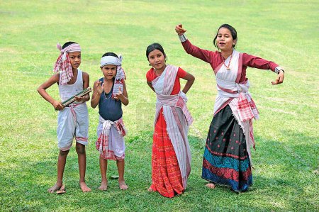 Photo for Assamese girls performing dance and celebrating Bihu festival (new year celebration) Assam, India - Royalty Free Image