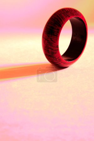 Photo for Maroon and black colours on wooden bangle on white background - Royalty Free Image