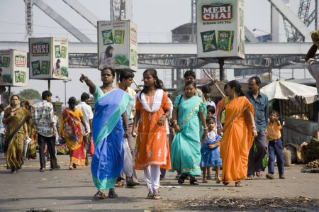Photo for Street Scene ; activities in market pedestrian walking around ; Howrah Bridge now Rabindra Setu ; Calcutta now Kolkata ; West Bengal ; India - Royalty Free Image