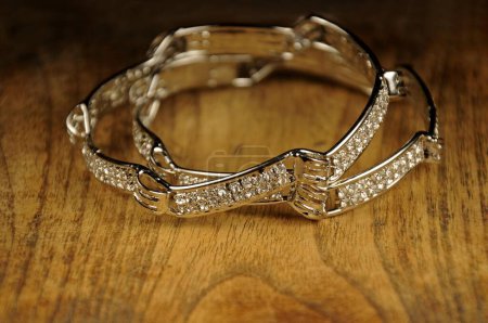 Photo for Diamond bangles on wooden background, Indian Traditional jewelry - Royalty Free Image