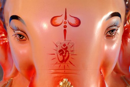 Close ups of Idol of lord Ganesh Ganpati elephant headed god or Vinayak Gajanan , India