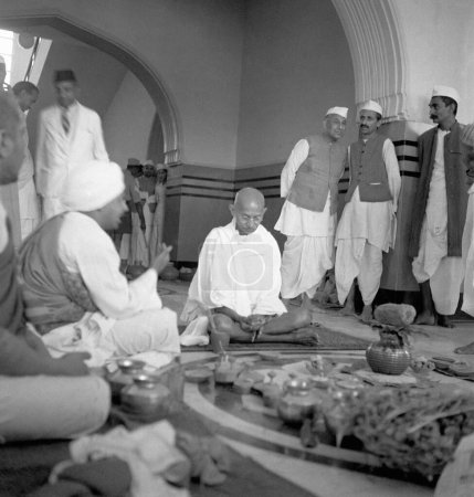 Photo for Dr. Jivraj Mehta, Mahatma Gandhi, Rajendra Prasad and others at the opening ceremony of Kamla Nehru Memorial Hospital at Allahabad, 28th February 1941, India - Royalty Free Image