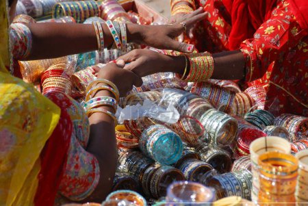 Purchasing glass bangles ; Jodhpur ; Rajasthan ; India