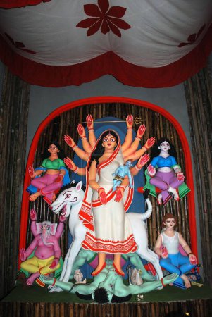 Photo for Decorative Durga clay model killing demon mahishasura with statues of kartikeya ganesha and lakshmi saraswati on Durga puja - Royalty Free Image