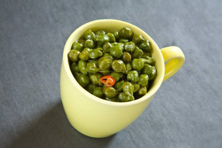 Photo for Indian breakfast green chickpeas chana salad served in mug on black background 12-May-2010 - Royalty Free Image