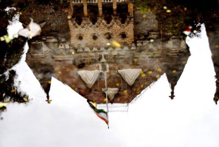 Reflection of high court in water with coconut tree and flag; Bombay Mumbai ; Maharashtra ; India