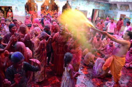 Photo for People playing with gulal on holi festival at ghanshyam ji temple, Jodhpur, Rajasthan, India - Royalty Free Image