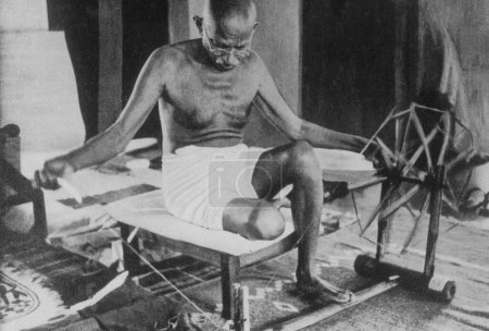 Photo for Mahatma gandhi working on charkha India - Royalty Free Image