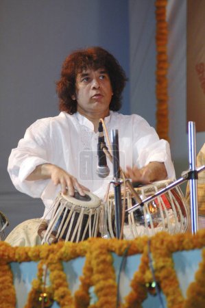 Photo for Music , Indian Classical Music , Musical Instrument , Drum , Tabla , Artist Ustad Zakir Hussain , Rhythm , Performing - Royalty Free Image