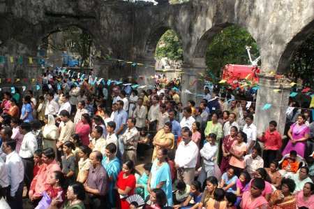 Photo for Thousands of Christians from Marol and around attended Holy mass organized by Parishioners of Marol Village at the Historic 500 year old St John The Baptist Church at Seepz, MIDC, Andheri (E) the western suburbs of Bombay now Mumbai, Maharashtra - Royalty Free Image
