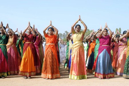 Photo for Women performing group dances in festive program, Kerala, India - Royalty Free Image