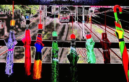 Photo for Umbrellas for sale on railway bridge - Royalty Free Image