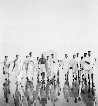 Photo for Mahatma Gandhi and others walking at Juhu Beach , Mumbai , May 1944 - Royalty Free Image