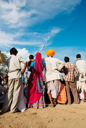 Photo for Villagers standing in ground, Rajasthan, India - Royalty Free Image
