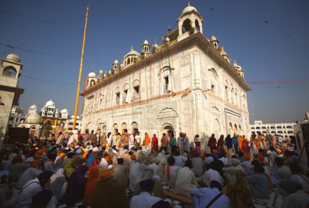 Photo for Celebrations of 300th year of consecration of perpetual Guru Granth Sahib Sikh, devotees praying at Sachkhand Saheb Gurudwara in Nanded, Maharashtra, India - Royalty Free Image