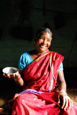 Photo for Ho tribes midwife with bowl of oil, Chakradharpur, Jharkhand, India - Royalty Free Image