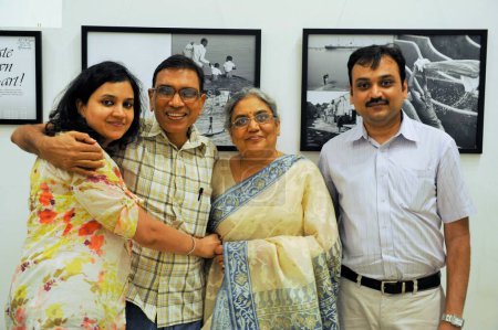 Photo for Family at Jagdish Agarwal photography exhibition, Jehangir Art Gallery, Mumbai, Maharashtra, India, Asia - Royalty Free Image