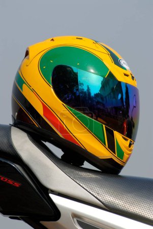 Photo for Colourful helmet on yamaha fz 150cc bike, India - Royalty Free Image