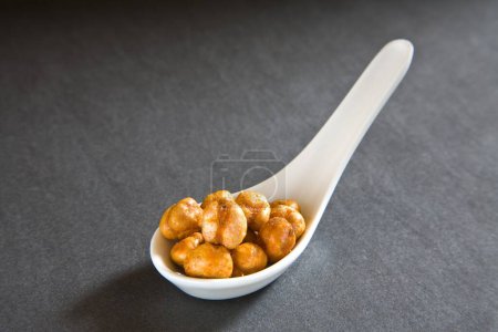 Photo for Indian breakfast fry chickpeas chana masala served in spoon on black background 12-May-2010 - Royalty Free Image