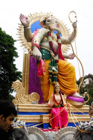 Photo for Arrival procession of big idol of lord Ganesh ; Elephant headed god of Hindu ; Ganapati Festival at Lalbaug ; Bombay Mumbai ; Maharashtra ; India - Royalty Free Image
