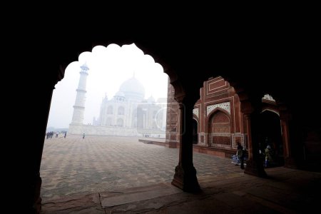 Taj Mahal from arch of mosque ; Agra ; Uttar Pradesh ; India