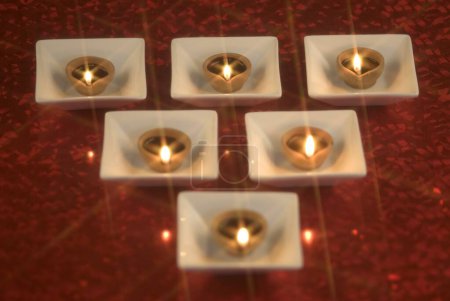 Diwali greeting card design divas oil lamps pantis