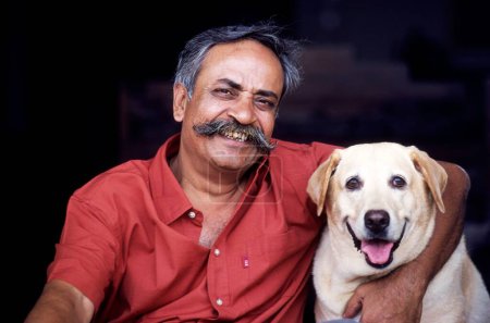 Photo for Piyush Pandey Ogilvy with dog - Royalty Free Image