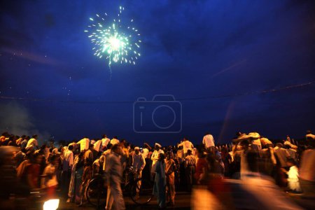 Photo for Firecrackers light sky after immersion of statue of lord Ganesh, Sangli, Maharashtra, India - Royalty Free Image