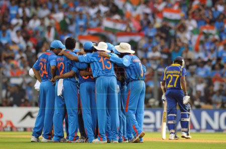 Photo for The Indian team huddle after the wicket of Thilan Samaraweera Not in picture of Sri Lanka during the 2011 ICC World Cup Final between India and Sri Lanka at Wankhede Stadium on April 2 2011 in Mumbai India - Royalty Free Image