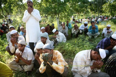 Photo for People praying during burial of their family members who died in powerful bomb blast on 29th September 2008 at Malegaon, Maharashtra, India - Royalty Free Image