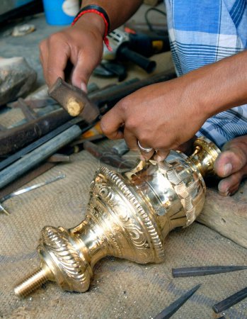 Brass oil lamp making at Nachiyarkovil near Kumbakonam ; Tamil Nadu ; India