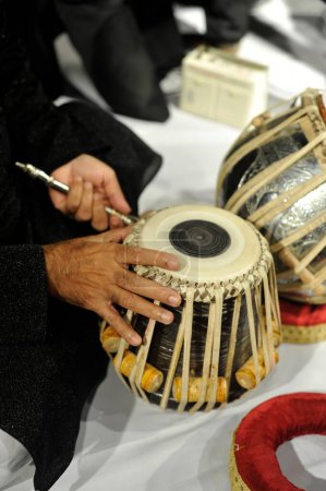 Photo for Tuning tabla Classical Indian Musical Instrument Mumbai Maharashtra India Asia - Royalty Free Image