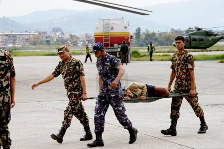 Photo for Army personnel carrying injured person, nepal, asia - Royalty Free Image