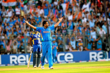 Photo for Indian bowler Zaheer celebrates after taking the wicket of Chamara Kapugedera of Sri Lanka Not in picture during the 2011 ICC World Cup Final between India and Sri Lanka at Wankhede Stadium on April 2 2011 in Mumbai India - Royalty Free Image