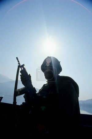 Photo for Soldier holding gun ; security at dal lake ; srinagar ; jammu and kashmir ; india - Royalty Free Image