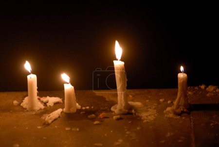 Candles of wax illuminated for celebrating Gudi Padva Festival ; New year of Hindu religion ; Masunda Tank ; Thane ; Maharashtra ; India
