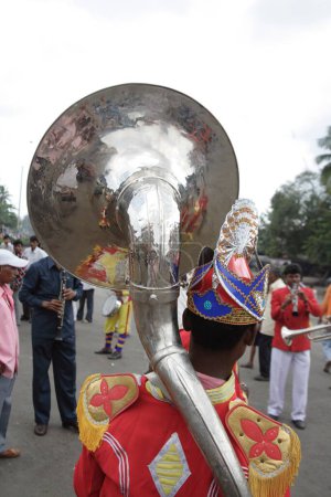 Photo for Man Blowing Instrument, Brass Band, India - Royalty Free Image