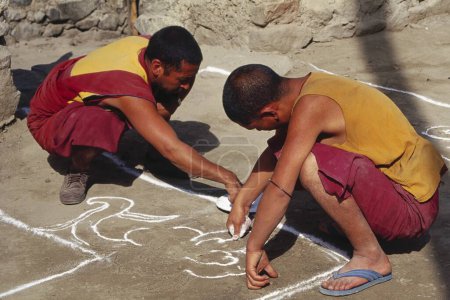 Photo for Buddhist Lamas making Rangoli - Samtanling Gompa - Sumar Village , Nubra Valley - Ladakh , India - Royalty Free Image