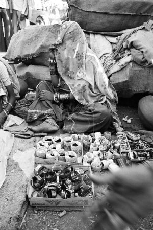 Woman bangle vendor Vautha fair Gujarat India Asia 1983