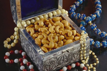 Photo for Dry fruit , masala flavored Cashew nuts in metal box - Royalty Free Image